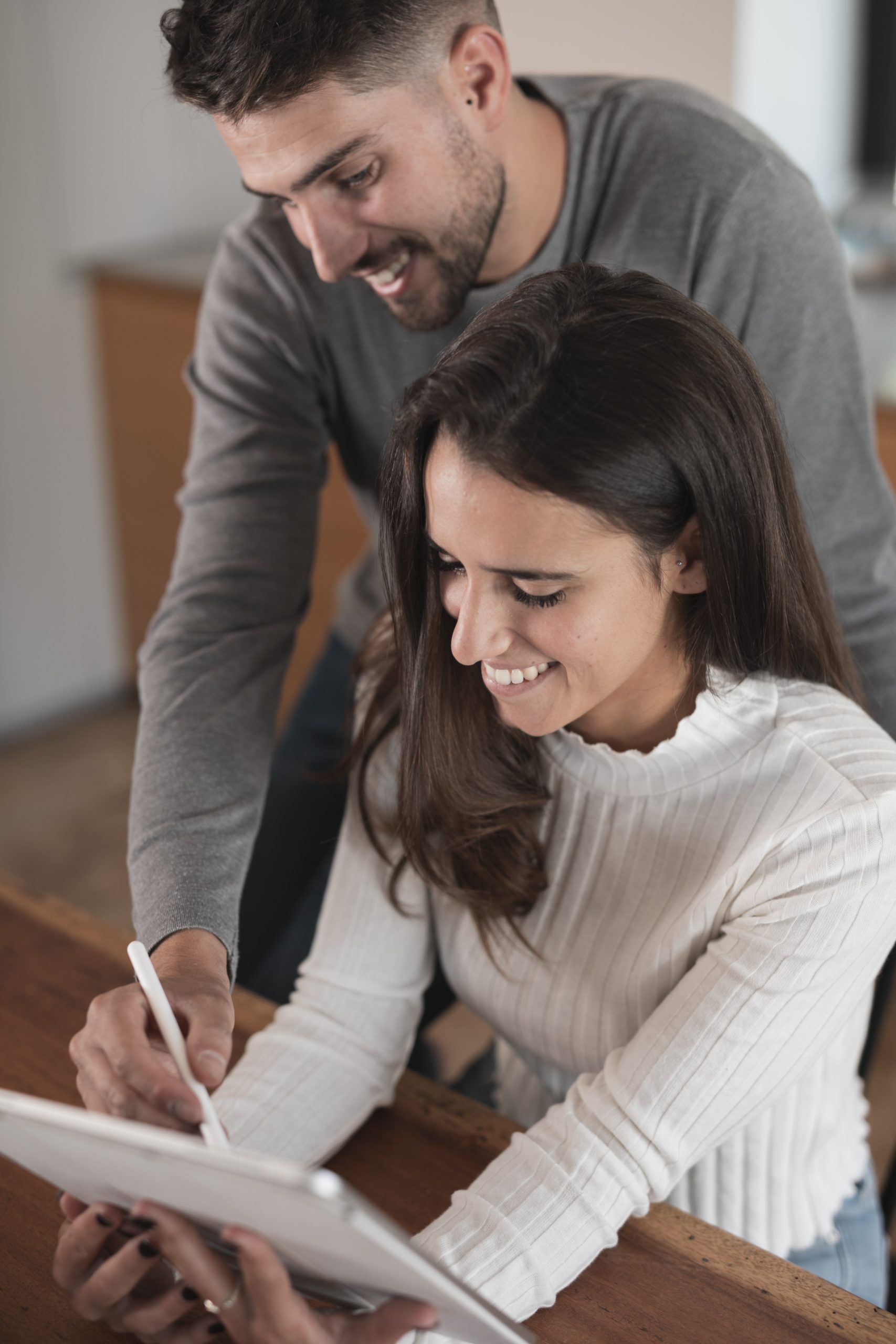 happy-couple-using-tablet